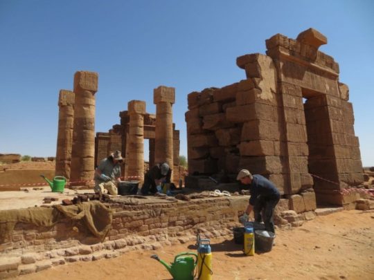 Conservators at work on the pylon of the Temple of Amun